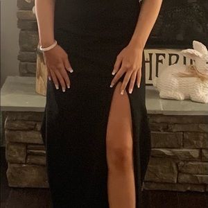 Size 4 worn once. The dress train was shortened. Slit front, back silver accents